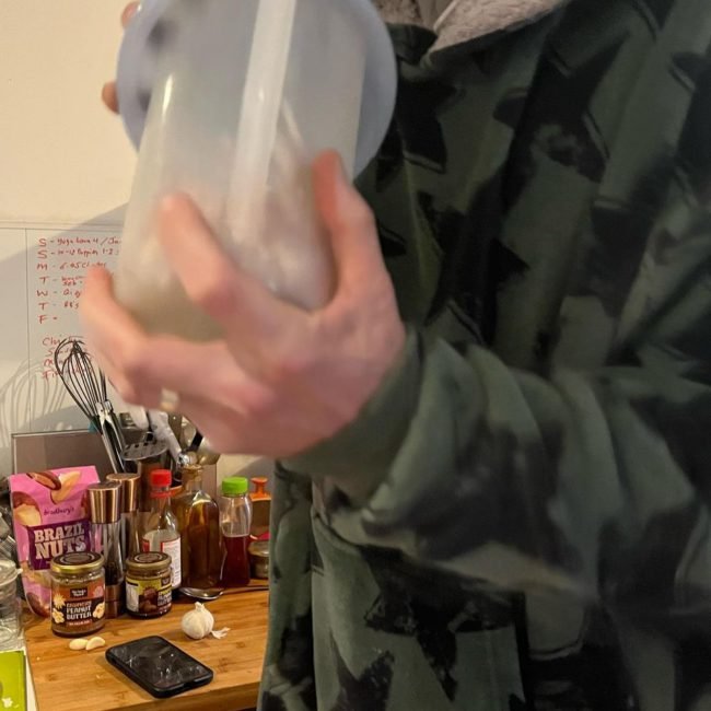 Shaking Garlic bulbs in a plastic container to remove their skin